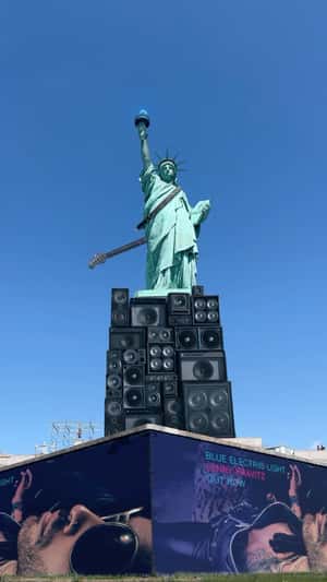 Guitar Hangs on Statue of Liberty in a fake-out-of-home ad of Lenny Kravitz 