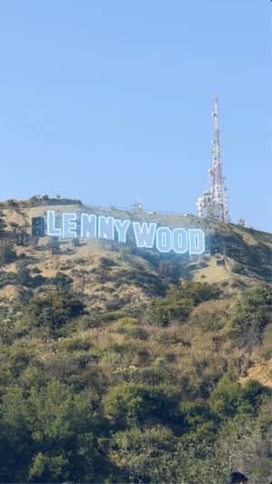 Sign Illuminates at Mount Lee in a fake-out-of-home ad of Lenny Kravitz