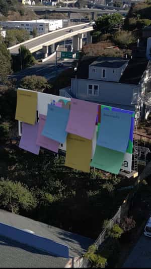 Billboards Covered with Stick Notes in a fake-out-of-home ad of Figma