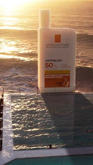 Giant Anthelios UVMune 400 Emerging from the Beach in a fake-out-of-home (FOOH) ad for La Roche-Posay