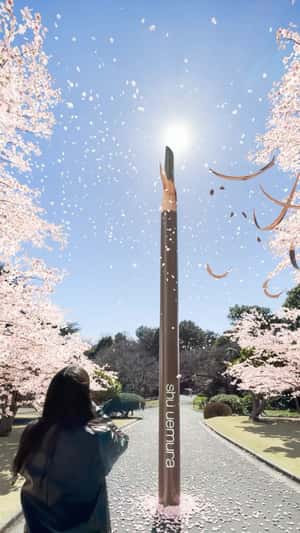 Giant eyebrow pencil display in fake-out-of-home ad of Shu Uemura