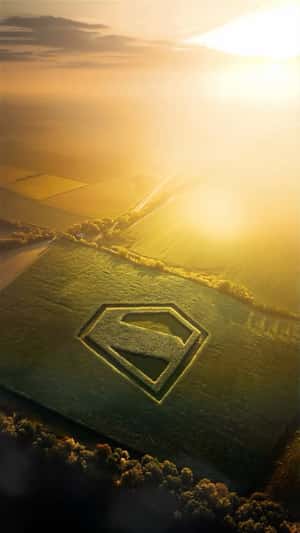 Logo Formed on Green Field in a fake-out-of-home ad of Superman