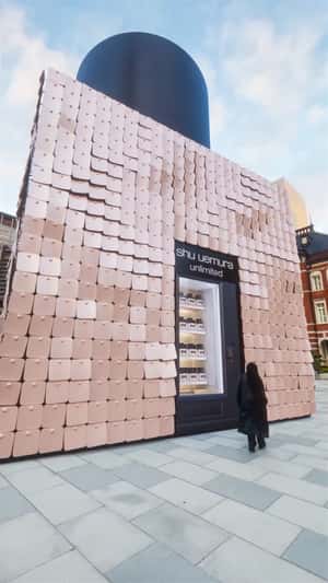 Giant Unlimited foundation vending machine in fake-out-of-home ad of Shu Uemura