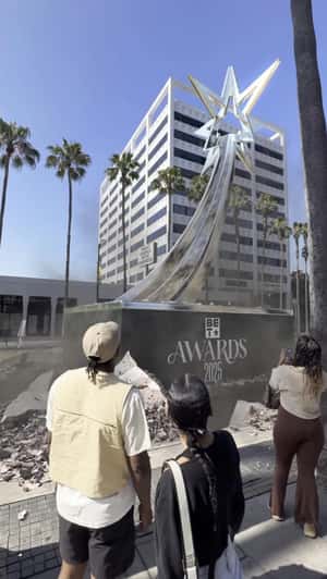Trophy Emerges On Sidewalk in a fake-out-of-home ad of BET