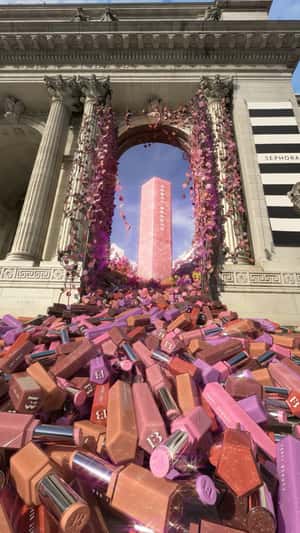 Lipsticks Flood from Public Library in a fake-out-of-home ad of Fenty Beauty
