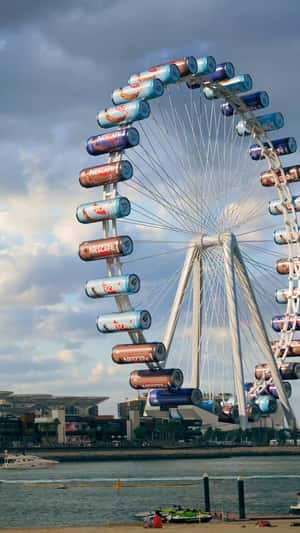 Coffee in Cans as Ferris Wheel Carts in a fake-out-of-home ad of Nestlé