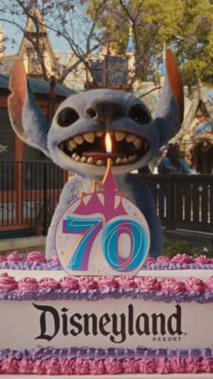 Stitch Enjoying Resort Rides in a fake-out-of-home ad of Disneyland