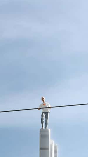 Man Pole Balancing on Smartphone in a fake-out-of-home ad of Verizon