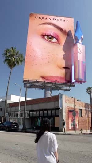 Eye Shadow Applies on Billboard in a fake-out-of-home ad of Urban Decay