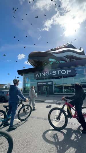 Raining Running Shoes in a fake-out-of-home ad of JD Sports