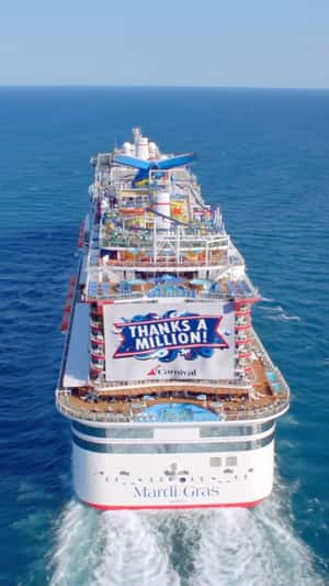 Banner Unfurls on Cruise Ship in a fake-out-of-home ad of Carnival Cruise