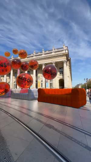 Sofas Colored by Tangerine Bubbles in a fake-out-of-home ad of Maisons du Monde