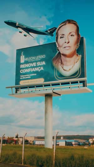 Billboard Face Transformation in a fake-out-of-home ad of Clinica Nelson Letizio