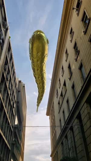 Golden Fish Swim on the Street in a fake-out-of-home ad of Anna Maria Mazaraki