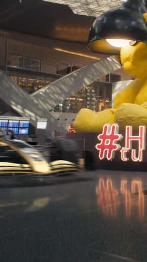 F1 Car Zooms at Airport Terminal in a fake-out-of-home ad of Duty Free 