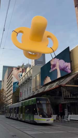 Soother Floats from City to Space in a fake-out-of-home ad of Tommee Tippee