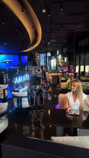 Robot Waiter with Hologram Menu in a fake-out-of-home ad of Amaya Dubai