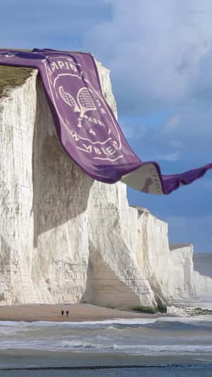 Towel Hangs Like Curtain on Cliff in a fake-out-of-home ad of Christy
