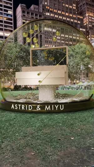 Golden Pearls Float on Snow Globe in a fake-out-of-home ad of Astrid & Miyu