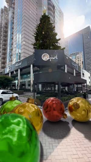 Christmas Balls Roll from Cafe in a fake-out-of-home ad of Aseel Restaurant & Cafe