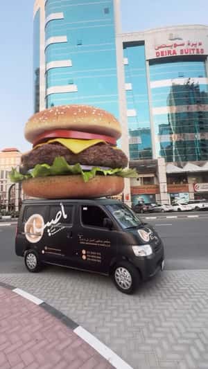 Burger Above Delivery Van in a fake-out-of-home ad of Aseel Restaurant