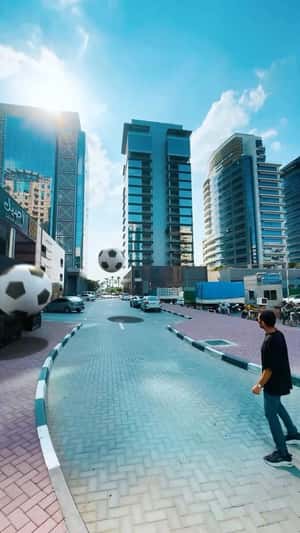 Soccer Balls Bouncing on Street in a fake-out-of-home ad of Aseel Restaurant