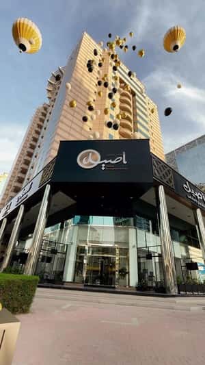 Balloons Floats from Cafe in a fake-out-of-home ad of Aseel Restaurant