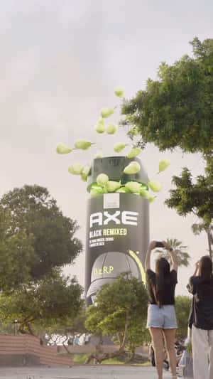 Perfume Spray Bottle Releases Pears in a fake-out-of-home ad of AXE