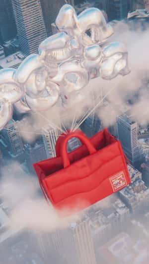 Tote Bags Float on Letter Balloons in a fake-out-of-home ad of Coachtopia