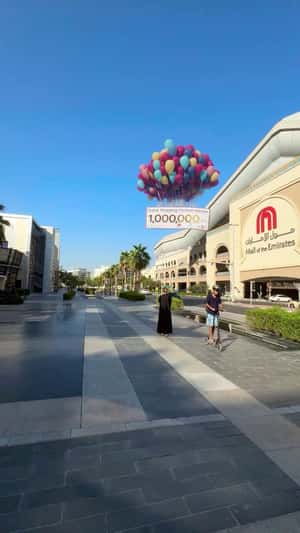 Gift Check Carried by Balloons in a fake-out-of-home ad of Mall of the Emirates