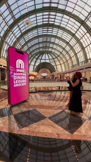 Robot Gives Rewards from Phone in a fake-out-of-home ad of Mall of the Emirates