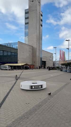 Vacuum Cleaner Sweeps City Square in a fake-out-of-home ad of Dreame