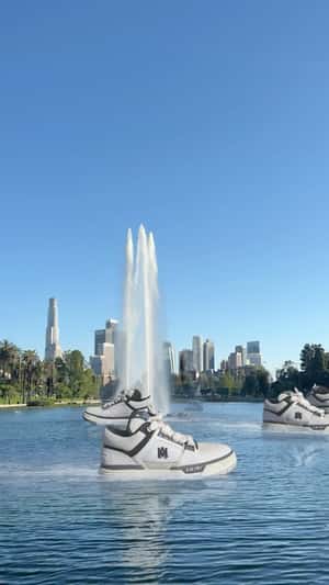 Giant Sneakers Floating in fake-out-of-home ad of AMIRI
