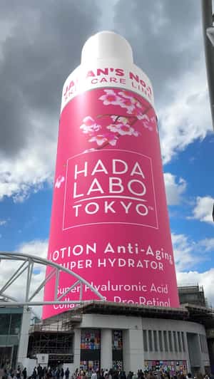 Tower Transformed into Lotion Bottle in a fake-out-of-home ad of Hada Labo Tokyo