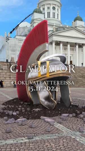 Leffamaailma Gladiator Helmet Burst from Ground in a fake-out-of-home ad of Leffamaailma