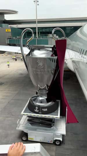 Giant trophy fake out of home ad of Qatar Airways