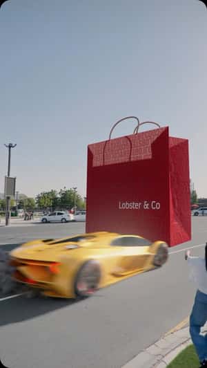 Sports Car Drifting Around Paper Bag in a fake-out-of-home ad of Lobster & Co