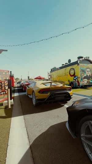 Sports Cars Line Up at Drive-Thru in a fake-out-of-home ad of Lobster & Co