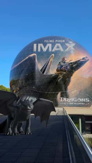 Dragons Playing Near Spherical Building in a fake-out-of-home ad of Pathé France