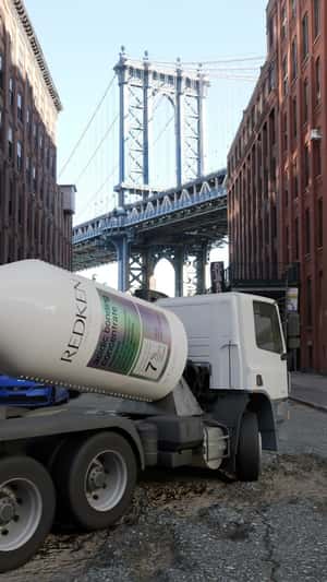 Shampoo Mixer Truck Fixes Potholes in a fake-out-of-home ad of RedKen