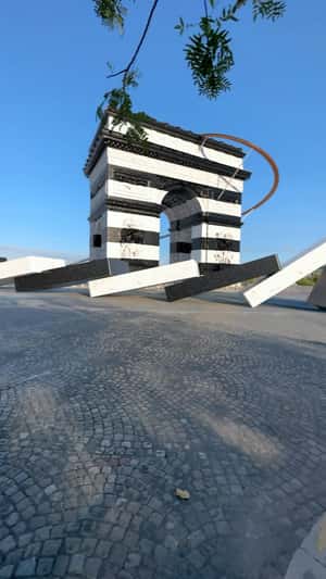 Dominoes Tumbles From Arc de Triomphe in a fake-out-of-home ad of Sephora