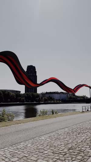 Striped Cloth Flying Across the City in a fake-out-of-home ad of Eintracht Frankfurt