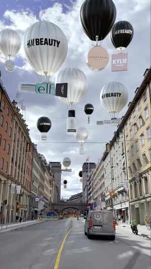 Products in Hot Air Balloon in fake-out-of-home ad of H&M Beauty