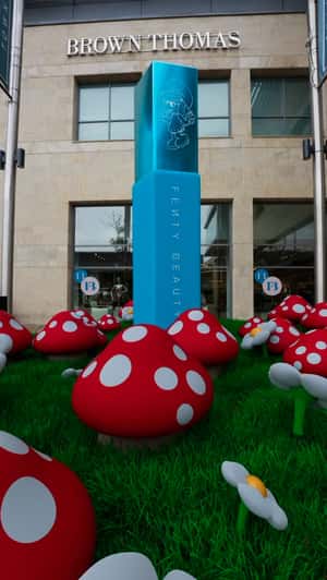 Smurf Village at Brown Thomas in a fake-out-of-home ad of Fenty Beauty