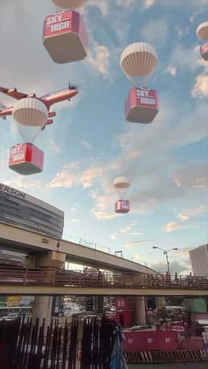 Parachute Package Delivery in fake-out-of-home ad of Maybelline