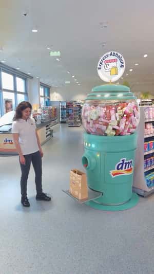 Gumball Dispenser Releases Beauty Products in a fake-out-of-home ad of DM