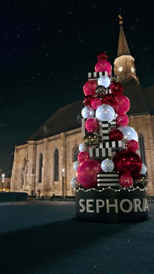 Christmas Tree Balls Towering at the Church in a fake-out-of-home ad of Sephora