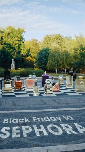 Perfumes on Ground Chessboard in a fake-out-of-home ad of Sephora