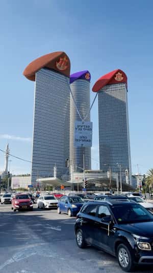 Towers Wearing Military Hands in a fake-out-of-home ad of Azrieli