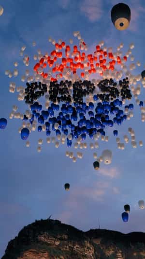 Sky Lanterns Forming Brand's Logo in a fake-out-of-home ad of Pepsi